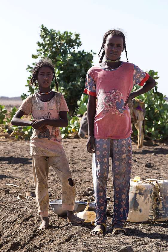 Nomad girls at a well, Bayuda Desert, Northern Sudan