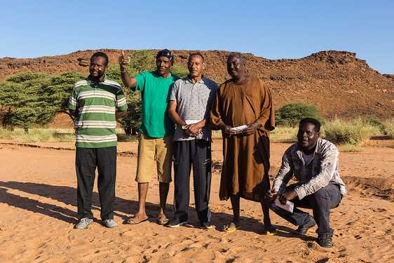 Farewell to the crew: Local guide Mohamed, driver Hawari, driver Abd Al Nasir (top), cook Moussa and driver Mudschahid, campsite near Naqa (Naga), Northern Sudan