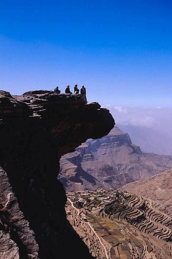 Standing on the edge of a cliff, Yemen mountains