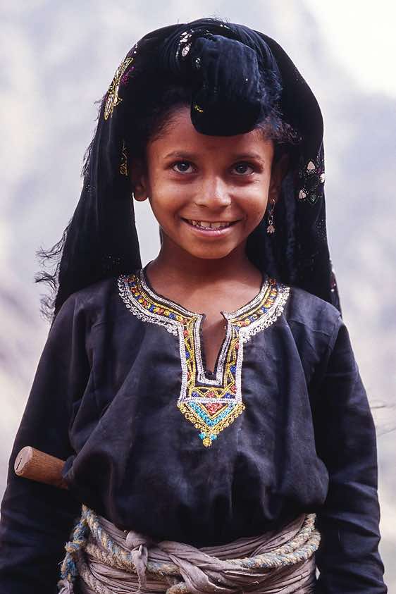 Girl in traditional dress, Jebel Rugab, Bura mountains