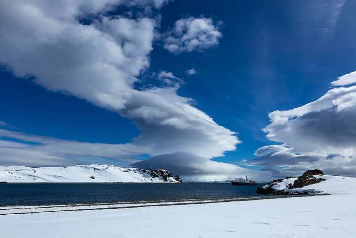 Lenticular clouds formed across Half Moon Bay, Half Moon Island, South Shetland Islands