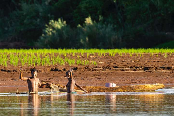 Man and woman fishing in the Tsiribihina River, Western Madagascar