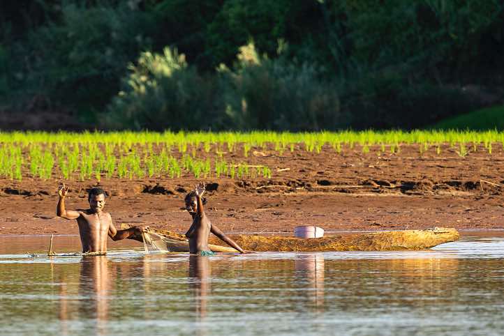 Man and woman fishing in the Tsiribihina River, Western Madagascar