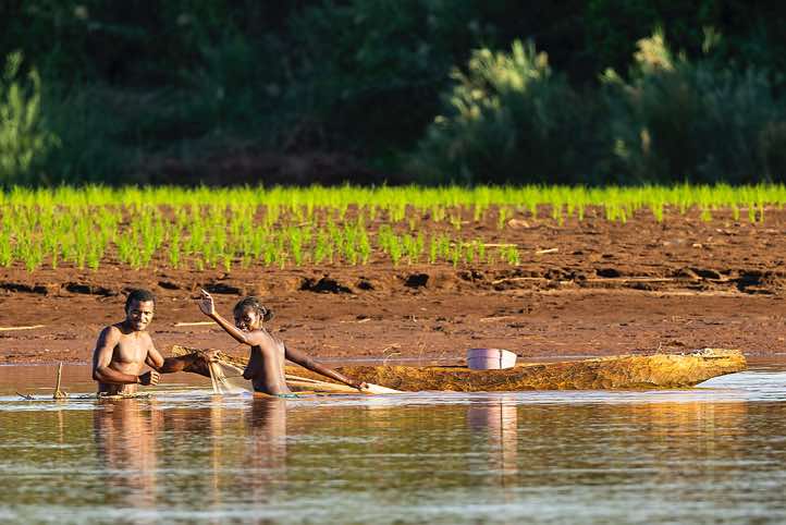 Man and woman fishing in the Tsiribihina River, Western Madagascar