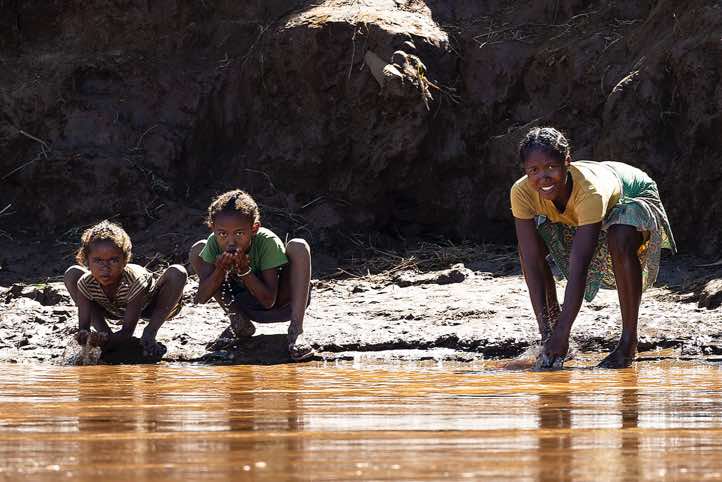 People drinking water of the Tsiribihina River, western Madagascar Western Madagascar