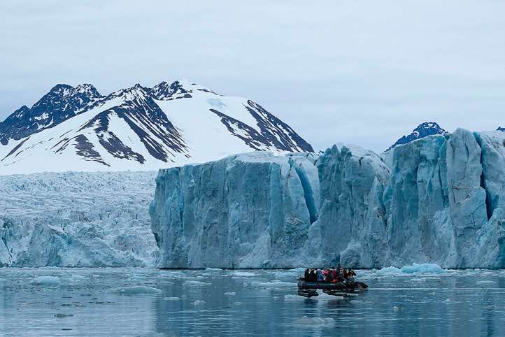 Zodiac in front of the Lilliehöök Glacier ice front, Krossfjorden
