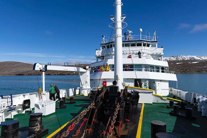 Expedition vessel Plancius sailing along the northern and western coasts of the Svalbard archipelago through Fuglefjorden and into Smeerenburgfjorden<br/>