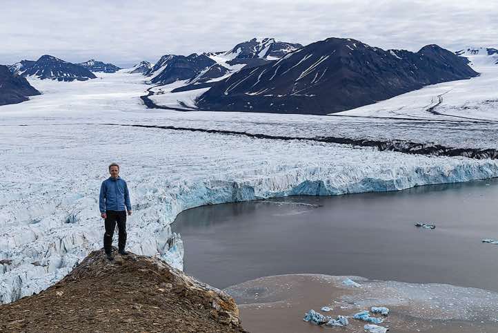 The photographer in front of a glacier on top of a mountain ridge, Valentinryggen, St. Jonsfjorden