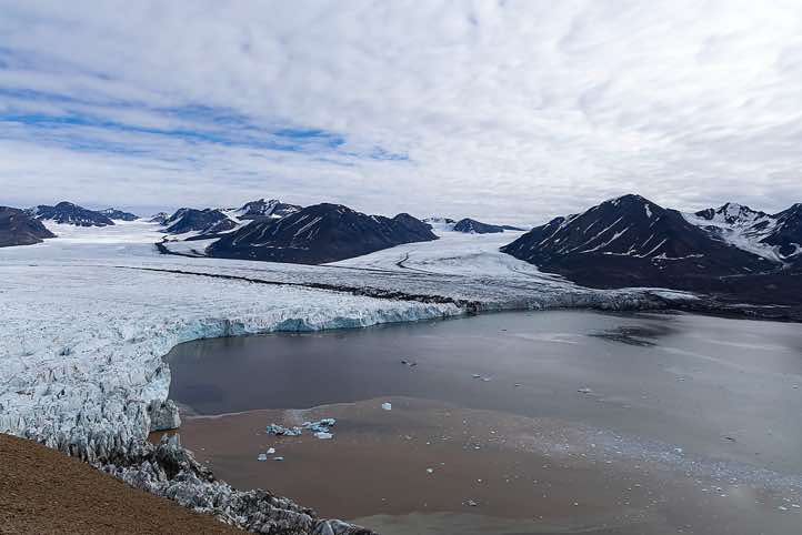Overlooking a glacier from the top of a mountain ridge, Valentinryggen, St. Jonsfjorden