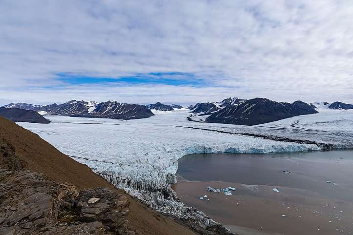 Overlooking a glacier from the top of a mountain ridge, Valentinryggen, St. Jonsfjorden