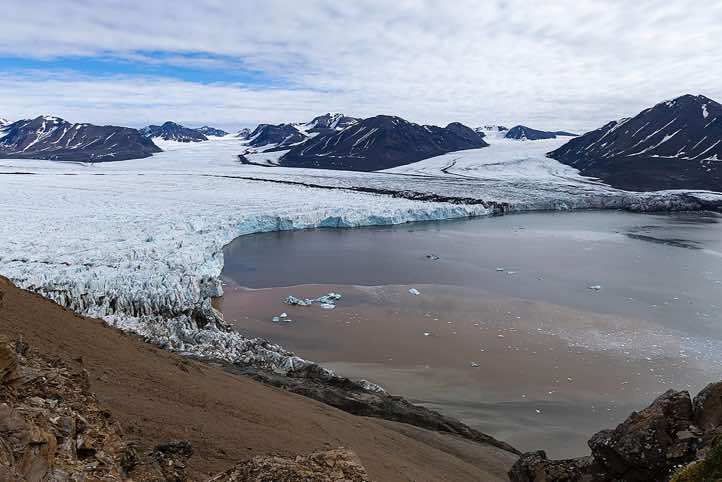 Overlooking a glacier from the top of a mountain ridge, Valentinryggen, St. Jonsfjorden