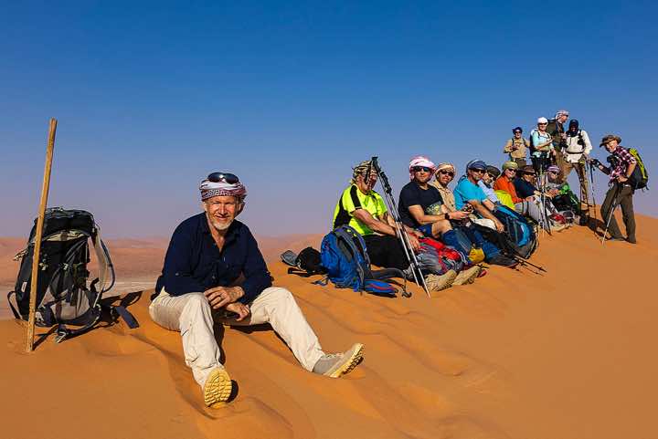 Jerome Blösser with hiking group resting in the sand dunes, desert landscape, Rub al Khali, Empty Quarter, Dhofar region
