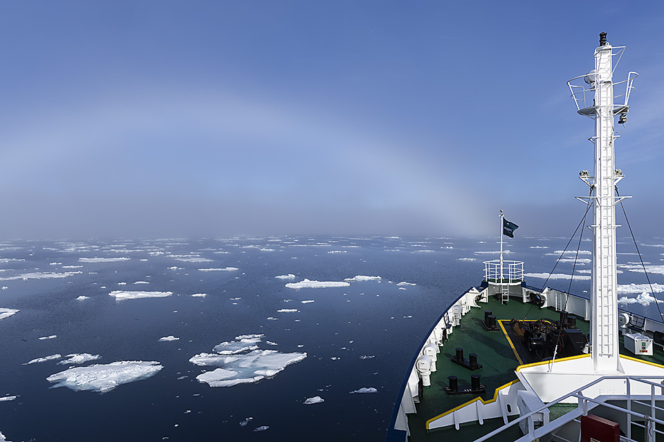 A fog bow, or white rainbow, seen from expedition vessel 'Plancius', Svalbarg, Arctic waters